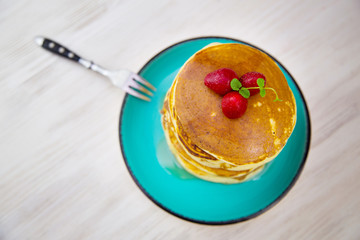 Top biew breakfast pancakes with strawberries and mint