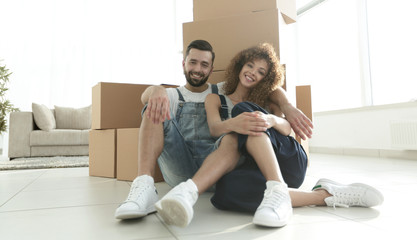 concept of moving to a new apartment. Happy couple