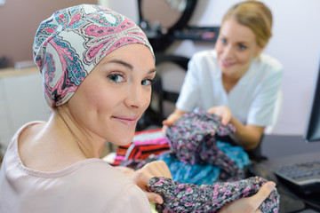 woman trying head scarves