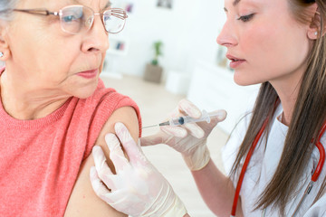 vaccinating an elderly person