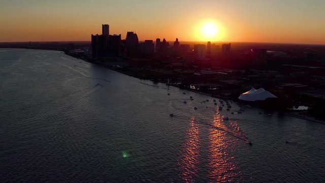 Slow Motion Aerial View of Detroit Skyline at Sunset