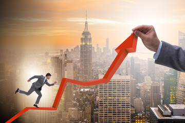 Businessman supporting growtn in economy on chart graph