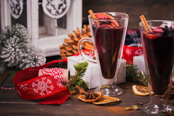 Mulled wine with fruits, cinnamon sticks, anise and decorations