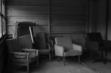 Chairs in abandoned botel B&W