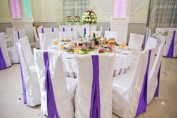 Wedding flowers decoration in the restaurant . Beautiful flowers on table in wedding day.