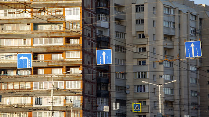 road signs against the background of apartment buildings