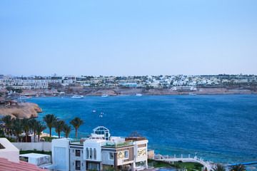 beautiful scenic landscape of the Egyptian embankment. white chic hotel blue azure sea in the background of the city