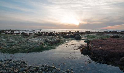 SUNSET OVER POINT LOMA TIDEPOOLS AT CABRILLO NATIONAL MONUMENT IN SAN DIEGO IN SOUTHERN CALIFORNIA UNITED STATES