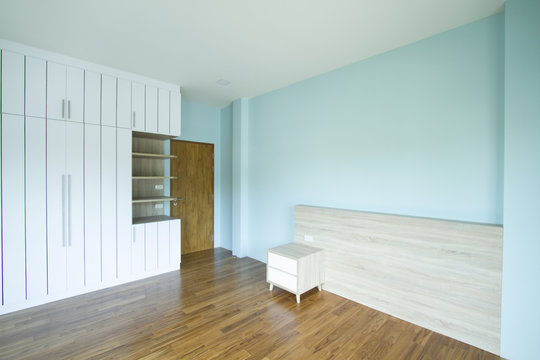 Modern style white wardrobes in light blue wall room