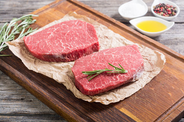 Raw beef steak with rosemary