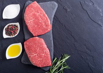 Raw beef steak with rosemary