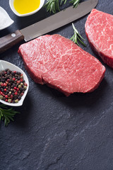 Raw beef steak with rosemary