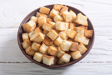 Crispy croutons in bowl