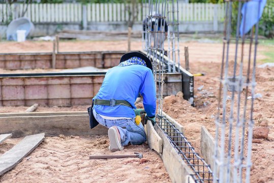 Construction work, the worker making formwork at construction site