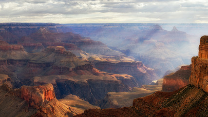 Fototapeta na wymiar Sunrise spilling into the Grand Canyon at Mohave Point