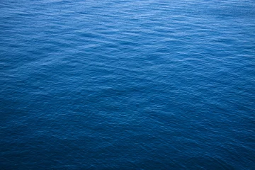 Zelfklevend Fotobehang The surface of the blue sea. © filatovamila