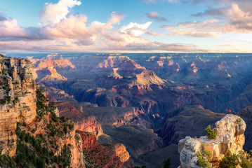 Fototapeta na wymiar Epic Grand Canyon - sunrise light from Mather Point with lone man