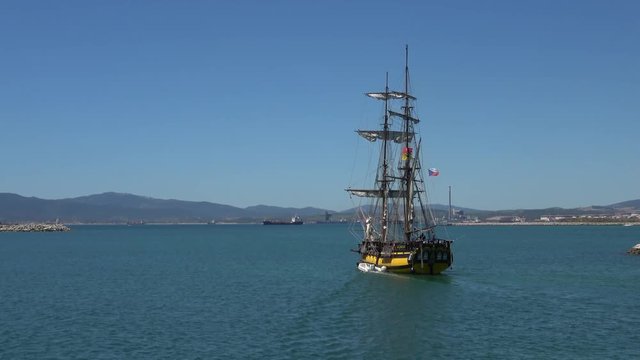 Tall ship leaving harbor
