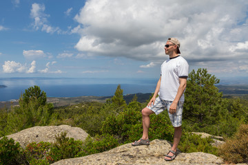 Naklejka premium Tourists men on Aegean coast of Sithonia peninsula