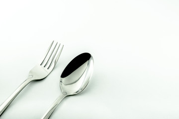 Spoon and fork isolated on white background. Used in advertising and design.
