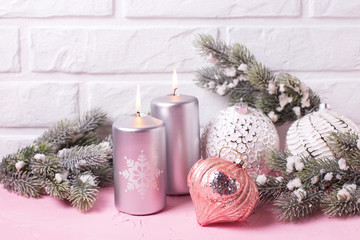 Silver candles, branches fur tree and balls