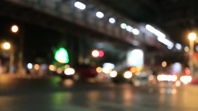 Night Traffic time in the Bangkok city. Out of focus with blurry. blur car lights and moving bokeh circles of defocused lights, unfocused city lights. traffic bokeh. Moving Bokeh Circles. Thailand.