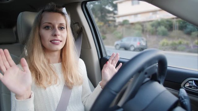 Woman in autonomous car driving and parking
