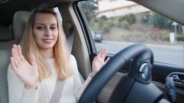 Woman in autonomous car driving and parking