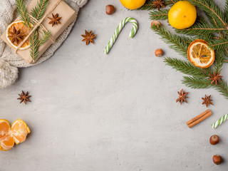 Winter hot chocolate drink in a Cup on a gray concrete background tangerines festive decorations Copy space