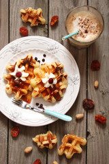 Waffles with whipped cream and berry jam