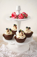 Cupcake with chocolate cream cheese, blueberry, chocolate chip and mint leaves