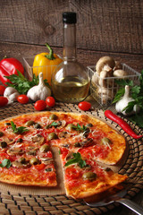 Pizza with tomatoes, mushrooms, black olives, Parmesan cheese, capers