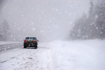 the car in the snow on the track