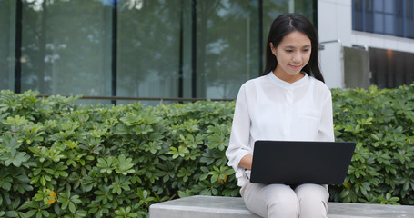 Young business woman use of laptop computer