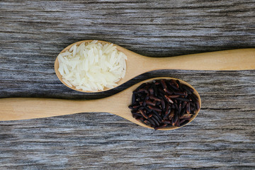 Riceberry and Jasmine rice in wooden spoon.