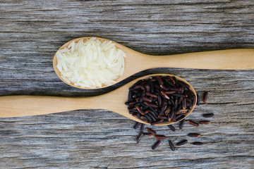 Riceberry and Jasmine rice in wooden spoon.
