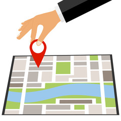 The hand puts a mark on map. Put a mark on the map.