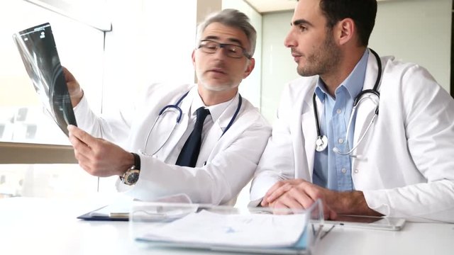 Doctors in office working on medical report