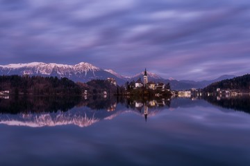 Twilight over the Lake Bled in Slovenia
The setting sun paints the landscape into pink colours over the reflecting scenic Lake Bled in Slovenia