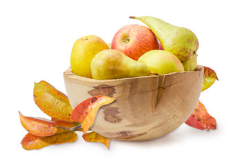 Apples and pears in wooden fruit dish and apple branch