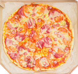 Top view of the pizza served in a cardboard box