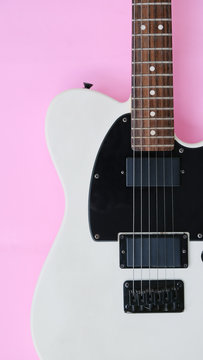 Detail of Electric Guitar on a pink background.