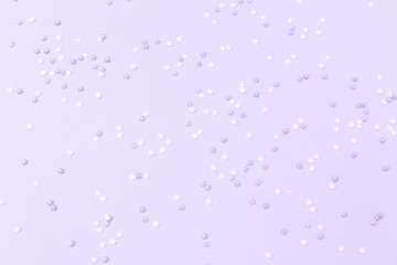 Snowflakes sprinkles. Festive holiday background. Celebration concept. Ultra violet tone, color of the year 2018