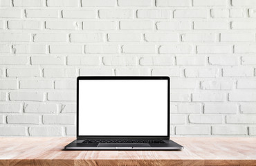 Modern computer,laptop with blank screen on white wall brick