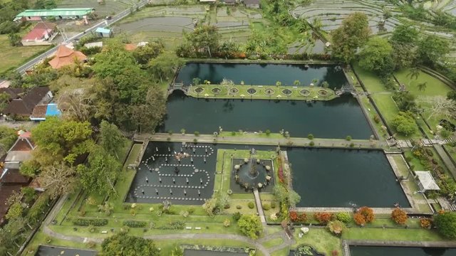Hindu Balinese Water Palace Tirta Gangga on Bali island, Indonesia. Aerial view Tirta Gangga the former royal water palace is a maze of pools and fountains surrounded by a lush garden and stone