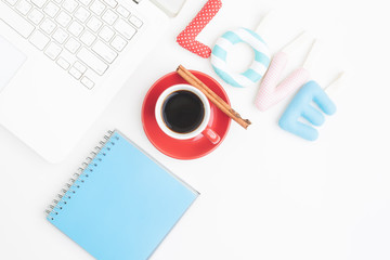 Top view of workspace with laptop, cup of coffee, Valentines Day concept
