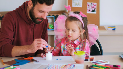 Fototapeta premium father help children art handmade concept. family values. talented little girl. rich imagination.