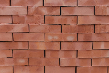 Obraz premium ceglany mur cegieł o różnych kolorach zbliżenie