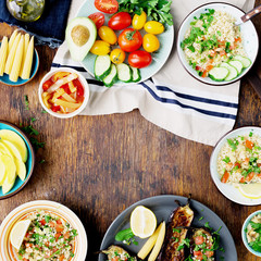 Frame from various vegetarian food on rustic wooden table
