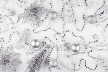 Christmas glitter silvery decoration and  on white modern background, top view.